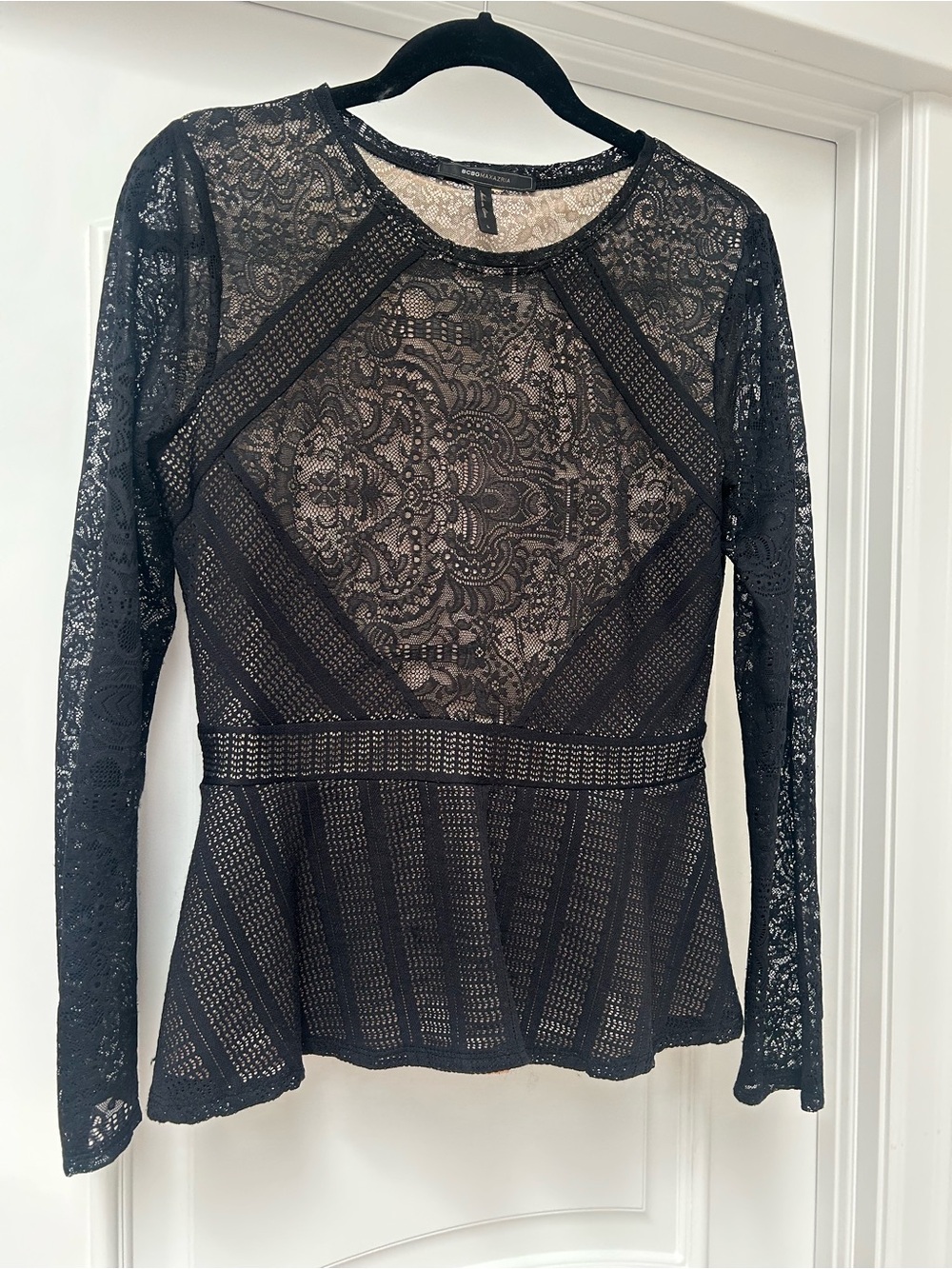 BCBGMaxAzria Black Lace Peplum-Style Long Sleeve Top. Smaller fit, but fabric is